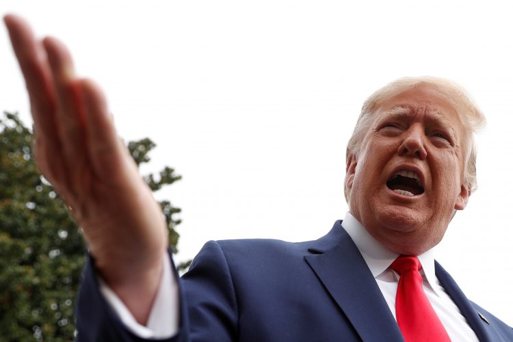 U.S. President Donald Trump speaks to reporters as he departs for travel to South Carolina, at the South Lawn of the White House in Washington, U.S., October 25, 2019. REUTERS/Tom Brenner