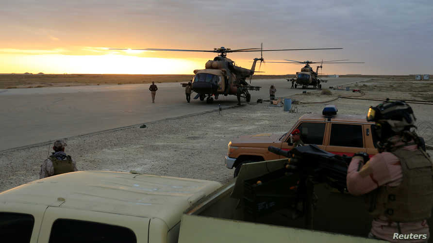 Iraqi Air Force helicopters land at Ain al-Asad airbase in the Anbar province, Iraq December 29, 2019. REUTERS/Thaier Al-Sudani